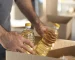 close-up-hands-holding-oil-bottles