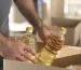 close-up-hands-holding-oil-bottles